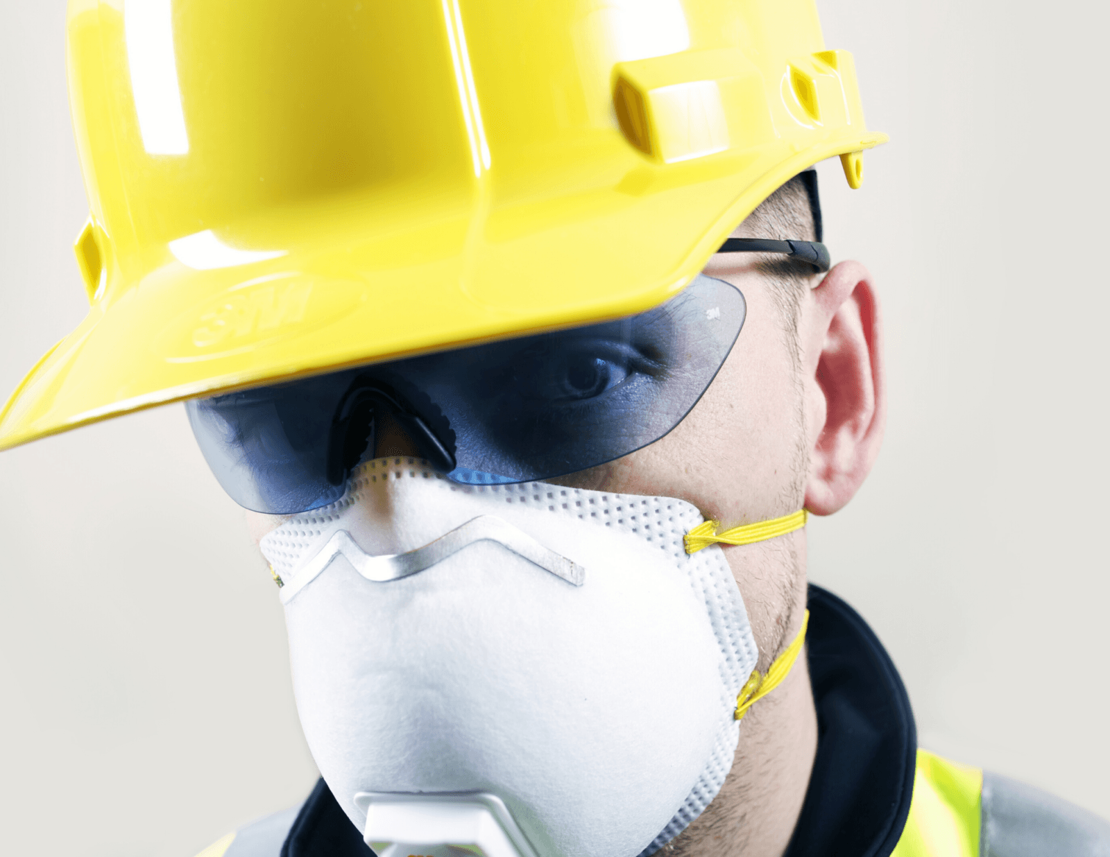 Performance Bonds and Coronavirus. This is a picture of a construction worker with a mask on his face.